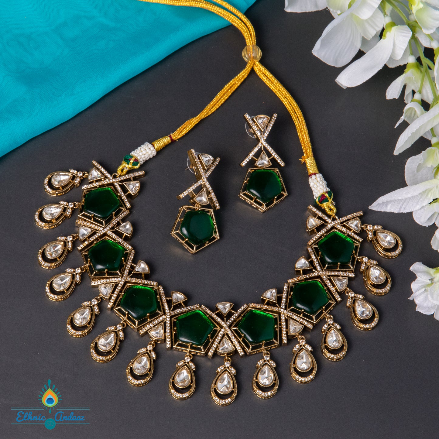 Laya Jaipuri necklace set with emerald accents and CZ stones, including matching earrings for elegant occasions.