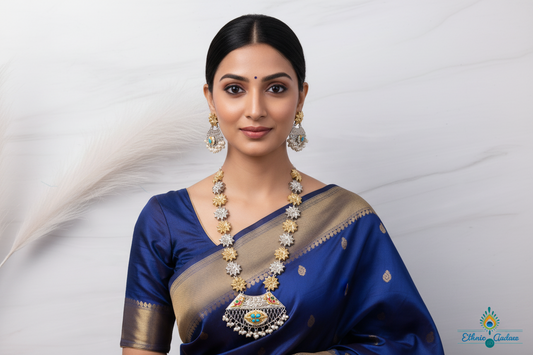 Model wearing Lassya oxidised jewelry set with a blue saree, featuring intricate jadau kundan designs.