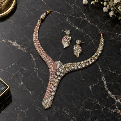 Ruby-inspired cubic zirconia necklace and earrings arranged on a polished dark marble surface.