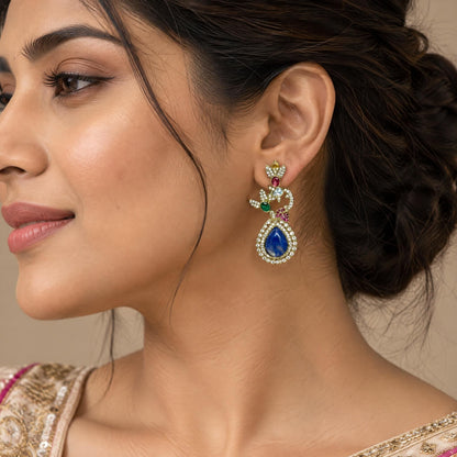 Close-up side profile of an Indian model showcasing the detailed metalwork of a premium drop earring.
