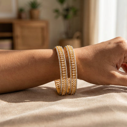 Side view of Indian woman's wrist resting on textured fabric, displaying a petite Teji CZ bangle in natural morning light.